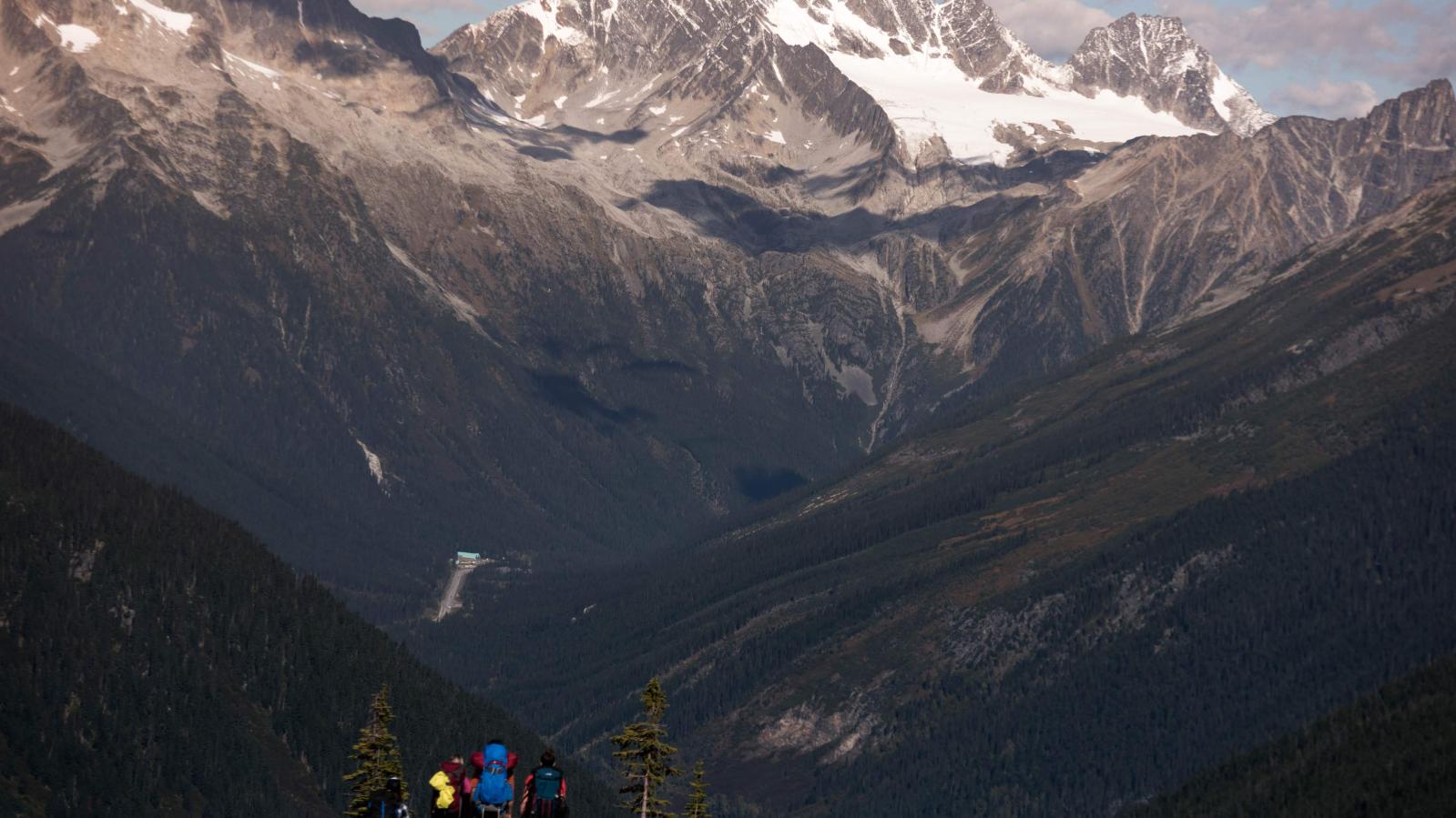 Hikers in Rogers Pass Hikers overlook the vistas of Rogers Pass